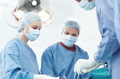 Buy stock photo Surgery, hospital and doctor advice in operating room for assistant, emergency or operation. Healthcare people, collaboration and medical surgeons with surgical tools, teamwork and clinic service