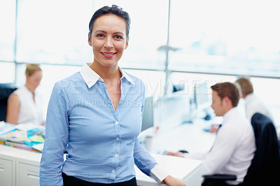 Buy stock photo Portrait, smile and businesswoman in office as manager or leader with team for growth and development. Coworking, confident and proud director in workplace with employees or busy staff in company