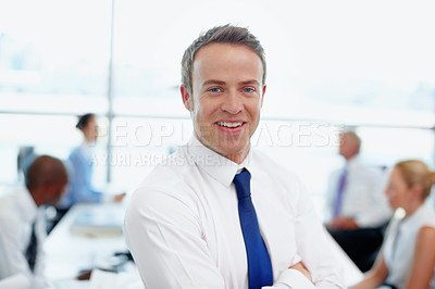 Buy stock photo Handsome young male executive in his workplace