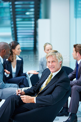 Buy stock photo Proud, meeting and confident businessman with portrait and legal team for court case and people. Mature, smile and happy lawyer in office with attorney and advisor at law firm for feedback review