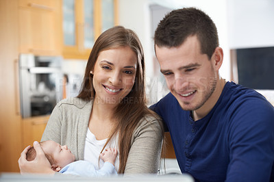 Buy stock photo Parents, baby and laptop in home for movie, streaming online and news on couch in living room. Film subscription, child and happy family on technology to relax with mom, dad and newborn for break
