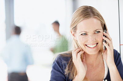Buy stock photo A young woman talking on the phone with a smile - copyspace