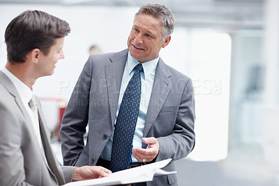 Buy stock photo A senior executive having a friendly conversation with a colleague - Copyspace