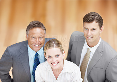 Buy stock photo Top-view of a trio of executives looking up at you confidently
