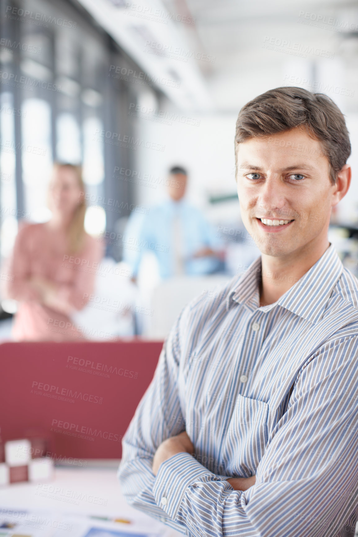 Buy stock photo Portrait of a young designer crossing his arms confidently at the office