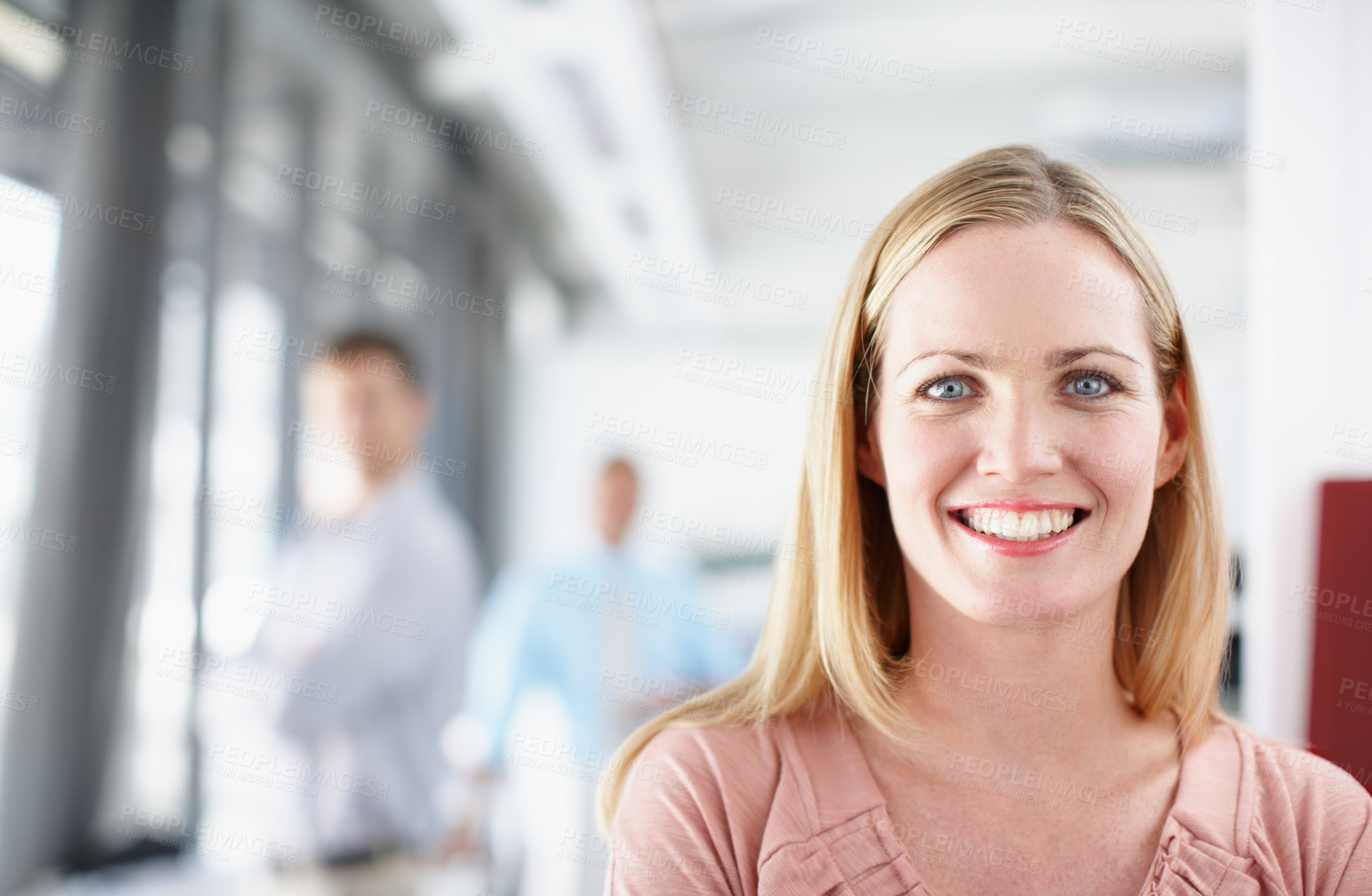 Buy stock photo Portrait of a young designer in the office with colleagues in the background