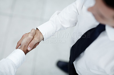 Buy stock photo Two businessmen shake hands