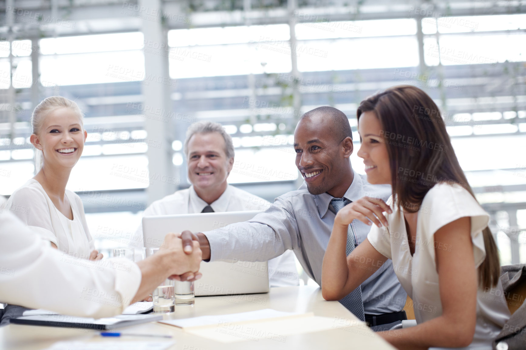 Buy stock photo Shot of a group of business people in a meeting