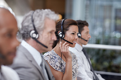 Buy stock photo Profile shot of an attractive customer service representative talking into a headset