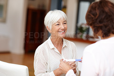 Buy stock photo Shot of a mother standing with her daughter as she waits on the results of a pregnancy test