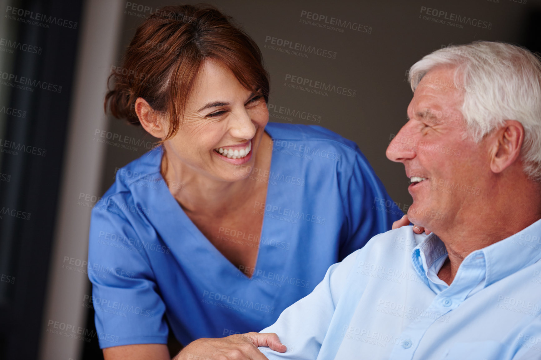 Buy stock photo Cropped shot of a female nurse checking on her senior patient
