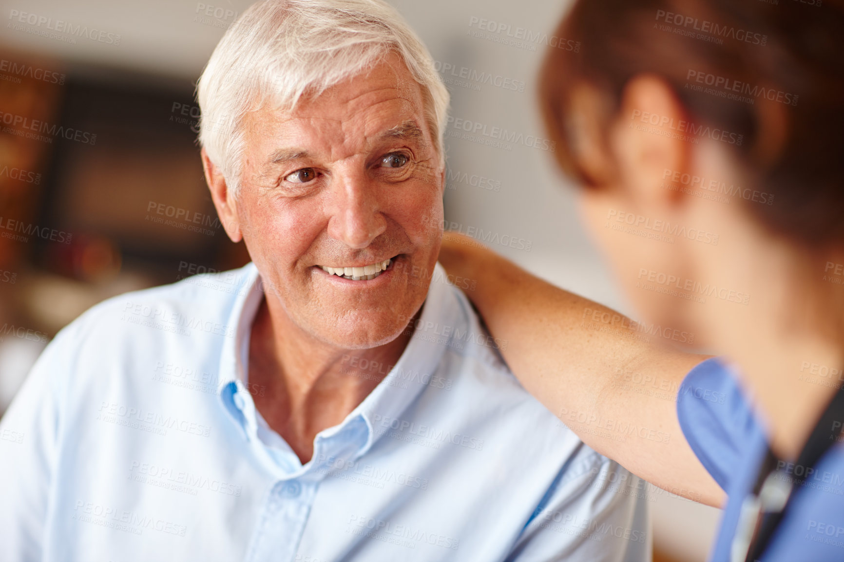 Buy stock photo Cropped shot of a female nurse checking on her senior patient