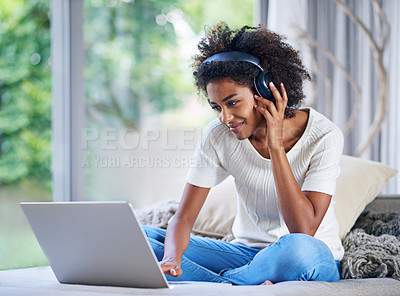 Buy stock photo Headphones, university student and laptop at home for online education, e learning and teaching in living room. Female person, computer and black woman in house for remote class, studying or tuition