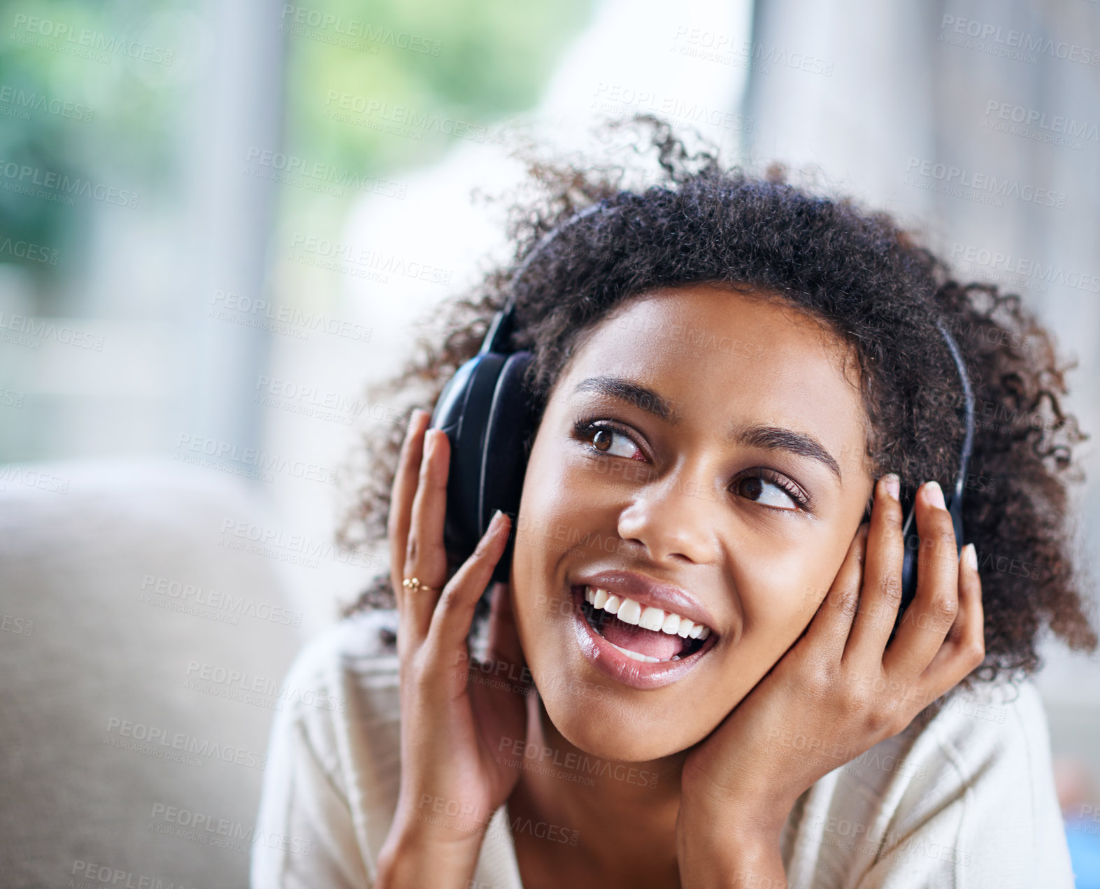 Buy stock photo Headphones, smile and happy woman person on couch, living room and listening to music. Happy, joyful or thinking while streaming audio, podcast or radio for entertainment for African female listener