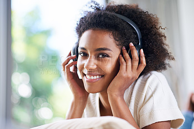 Buy stock photo Headphones, smile and portrait of woman at her home listening to podcast, music or radio. Happy, relax and young female person streaming song, playlist or album with technology in living room.