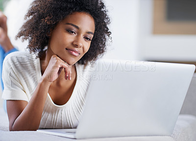 Buy stock photo Reading, laptop and woman on sofa working on freelance creative project in living room. Relax, technology and young African female designer typing on computer for research on couch in apartment.