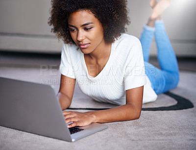 Buy stock photo Reading, computer and woman on floor working on freelance creative project in living room. Relax, technology and young female designer typing on laptop for research on rug in modern apartment.