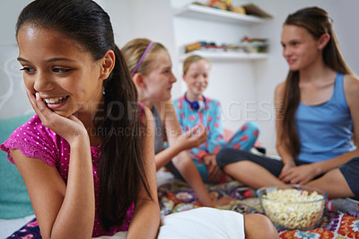 Buy stock photo Shot of a group of young friends enjoying a sleepover