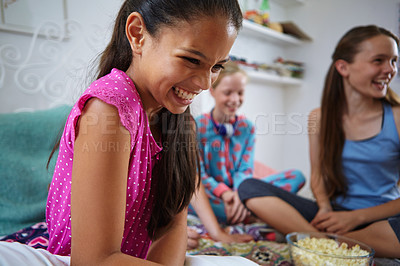 Buy stock photo Shot of a group of young friends enjoying a sleepover