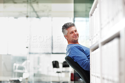 Buy stock photo Portrait of a mature businessman leaning back in his seat