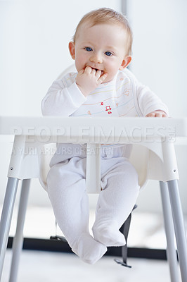 Buy stock photo Baby boy, eating and high chair in home, messy and playful with routine for feeding in morning. Infant, kid and child with face, development and growth with meal, food and nutrition at family house