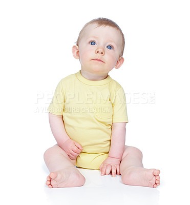 Buy stock photo Thinking, infant and curious for play in studio of sensory development, discovery activity and growth. Below, baby learning and motor skills, coordination and mobility of wellness on white background