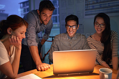 Buy stock photo Teamwork, night and a business group on a laptop, working in the boardroom for planning, strategy or innovation. Meeting, collaboration and overtime with a team of employees at work in the evening