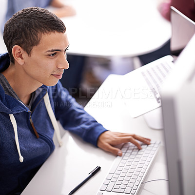 Buy stock photo Young man, computer and typing at office desk for web development, programming or information technology. Business programmer, worker or online designer on multimedia for planning and startup project