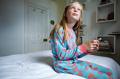 Buy stock photo Shot of a teenage girl texting in her bedroom