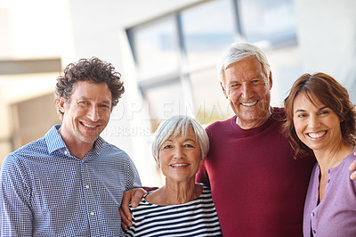 Buy stock photo Portrait of a senior couple standing outside with their children