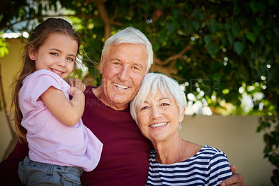 Buy stock photo Cropped portrait of a little girl spending time with her grandparents