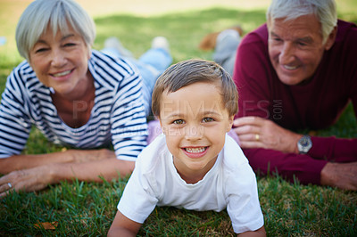 Buy stock photo Cropped portrait of a little boy spending time with his grandparents