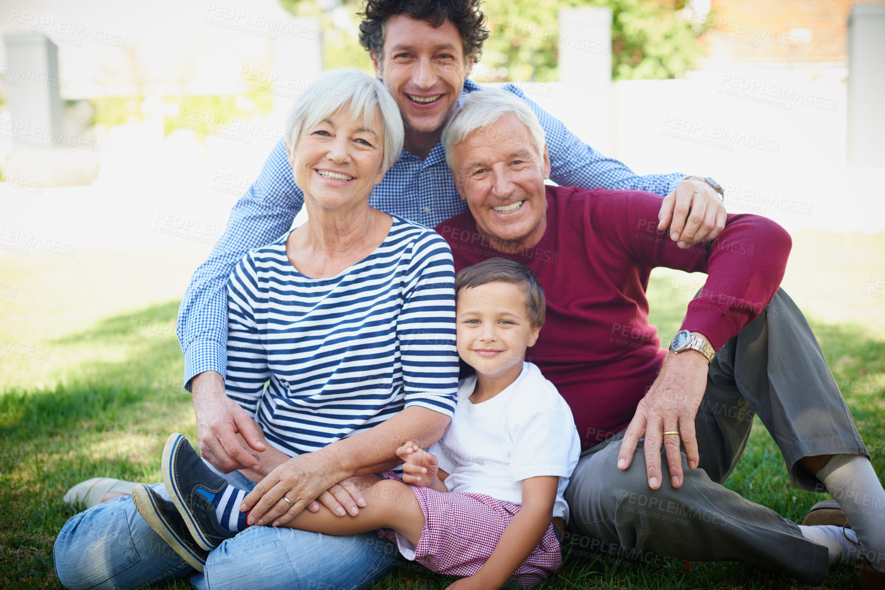 Buy stock photo Cropped portrait of a multi-generational family spending time together outside