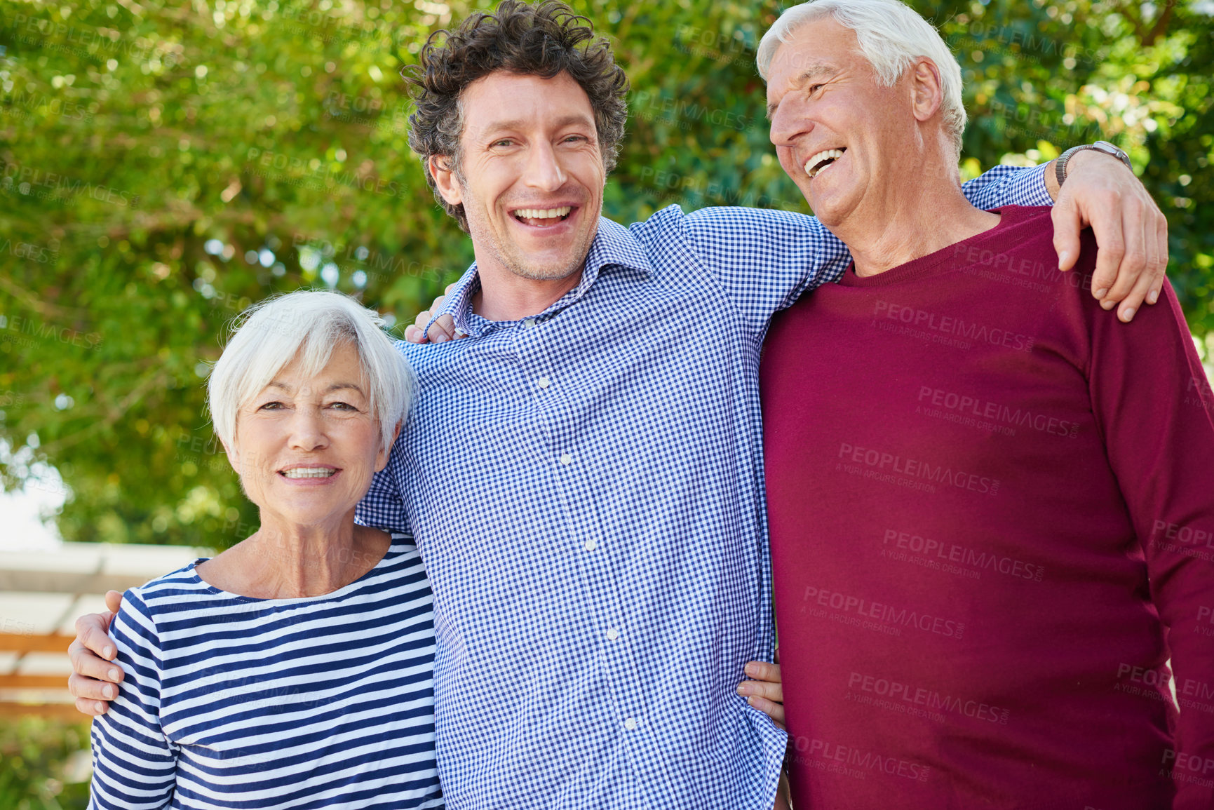 Buy stock photo Cropped portrait of a senior couple standing outside with their son