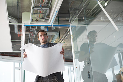 Buy stock photo Thinking, man or contractor at construction site with floor plan for building draft or industrial architecture project. Blueprint, engineer or builder planning for installation or renovation ideas