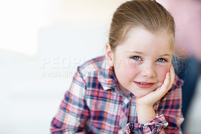 Buy stock photo Closeup portrait of a young girl leaning forward with her hand on her cheek