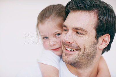 Buy stock photo Closeup shot of a little girl lovingly embracing her smiling father