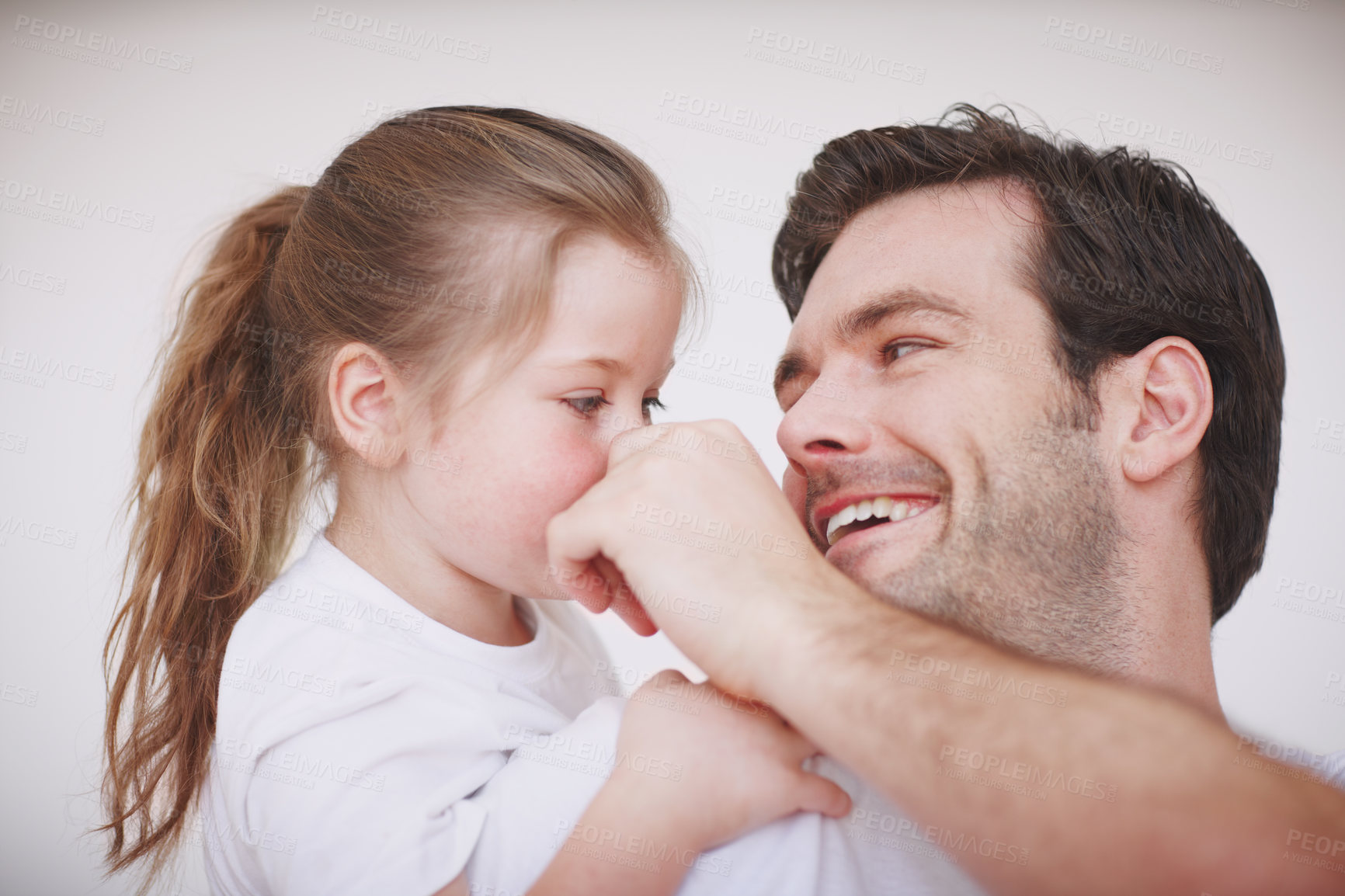 Buy stock photo Shot of a father and his young daughter being affectionate and spending quality time together