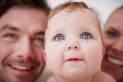 Buy stock photo Two loving young parents and their adorable baby girl - focus on foreground
