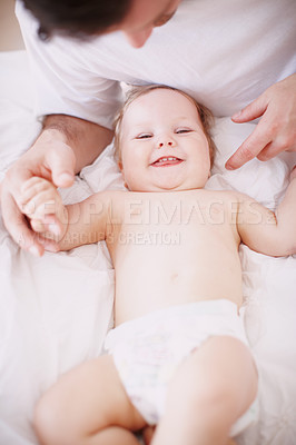 Buy stock photo Home, bed and father with baby in portrait, bonding together and child development with growth. House, family and dad with infant kid for playful, support and relationship with laughing from above