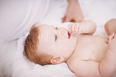 Buy stock photo An adorable baby girl relaxing with her parents