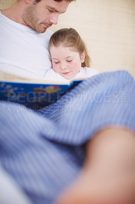 Buy stock photo Low-angle view of a father siting with his young daughter while she falls asleep