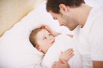 Buy stock photo Closeup shot of a dad putting his little girl to bed