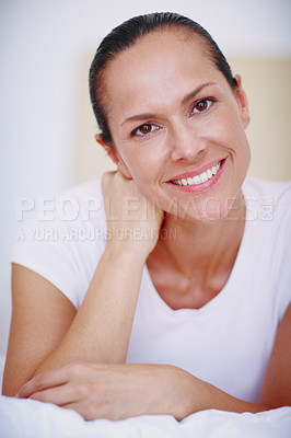 Buy stock photo Closeup portrait of a beautiful young woman relaxing on her bed