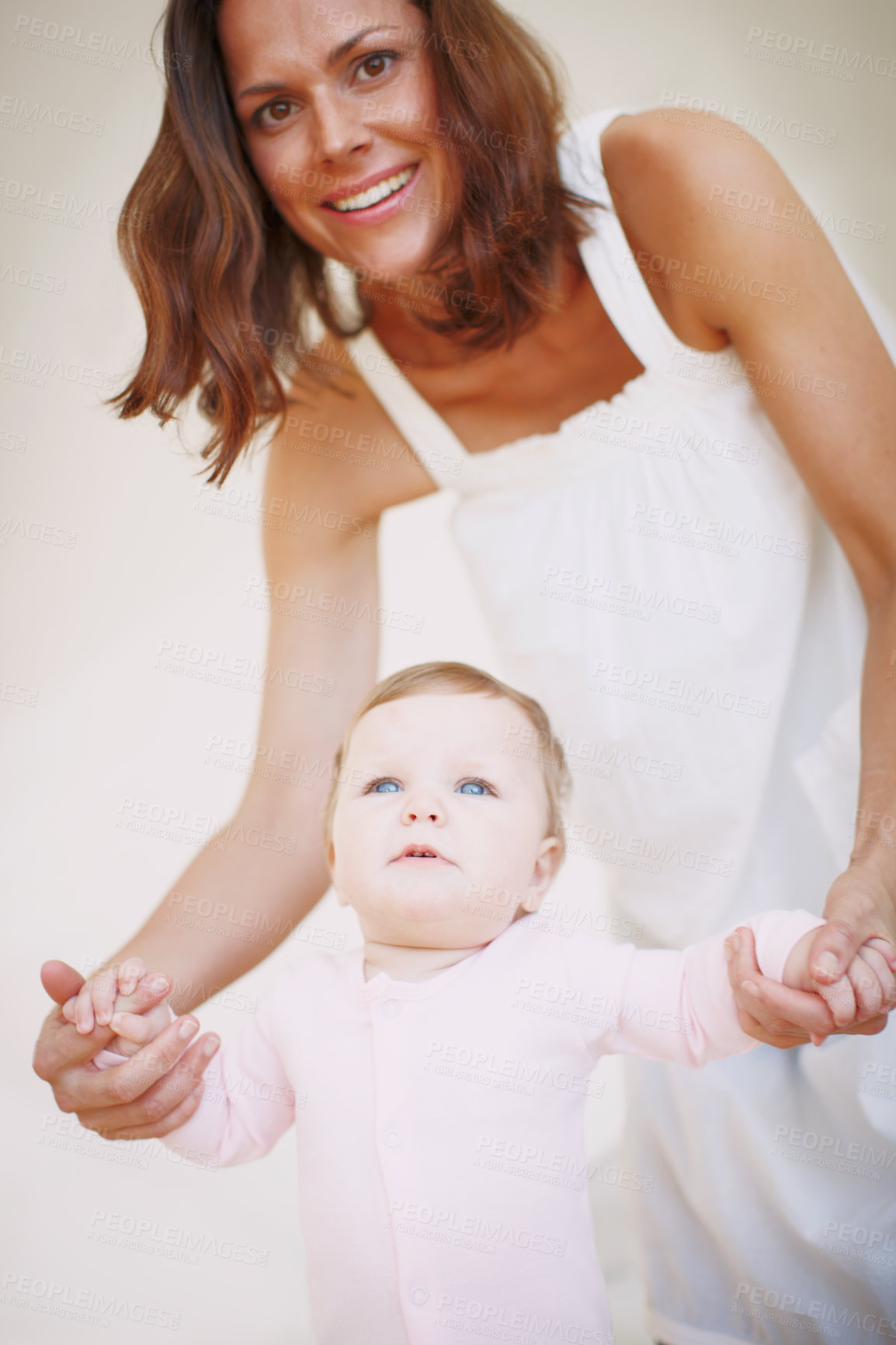 Buy stock photo Holding hands, walking and mother with baby in home for development, bonding and learning. Family, portrait and infant with woman for help, first steps or support for growth, motor skills and balance