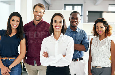 Buy stock photo Shot of a group of coworkers standing in an office