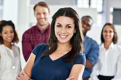 Buy stock photo Portrait of a businesswoman with her coworkers standing behind her