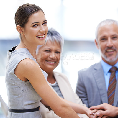 Buy stock photo Portrait, business woman and hands together for collaboration, smile and solidarity. Group, teamwork and community huddle of employees for support, mission or cooperation for goals in partnership.