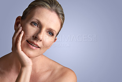 Buy stock photo Face, beauty and space with mature woman in studio on gray background for aesthetic wellness. Skincare, relax and mock up with natural skin person at spa for antiaging cosmetics or treatment