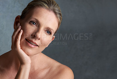 Buy stock photo Face, skincare and space with mature woman in studio on gray background for aesthetic wellness. Beauty, relax and mock up with natural skin person at spa for antiaging cosmetics or treatment